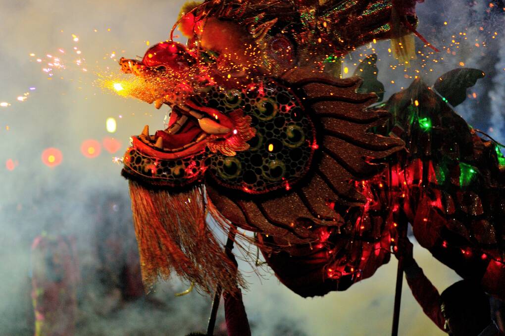 Dragons: Dancing, music and wearing colourful costumes are all part of welcoming in the New Year. 