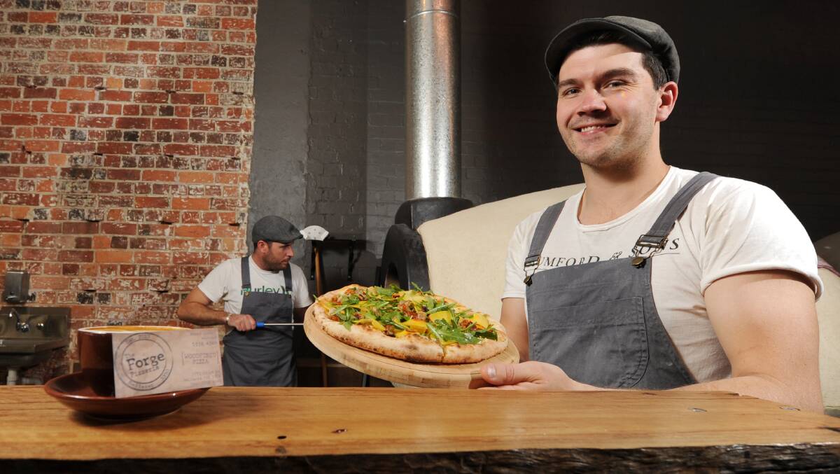 The Forge Pizzeria has been named one of the best places for pizza in Australia.  Chris Matthews and Josh Chapman with some of their pizzas. Picture: Lachlan Bence.