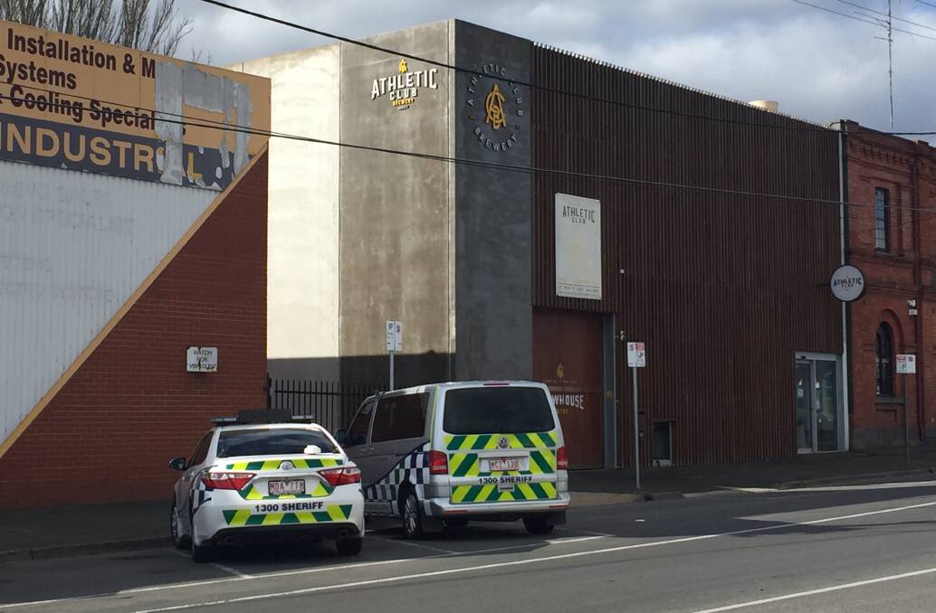 Warrants: Sheriff's Office Victoria vehicles outside the Athletic Club Brewery in Mair Street on Thursday afternoon.