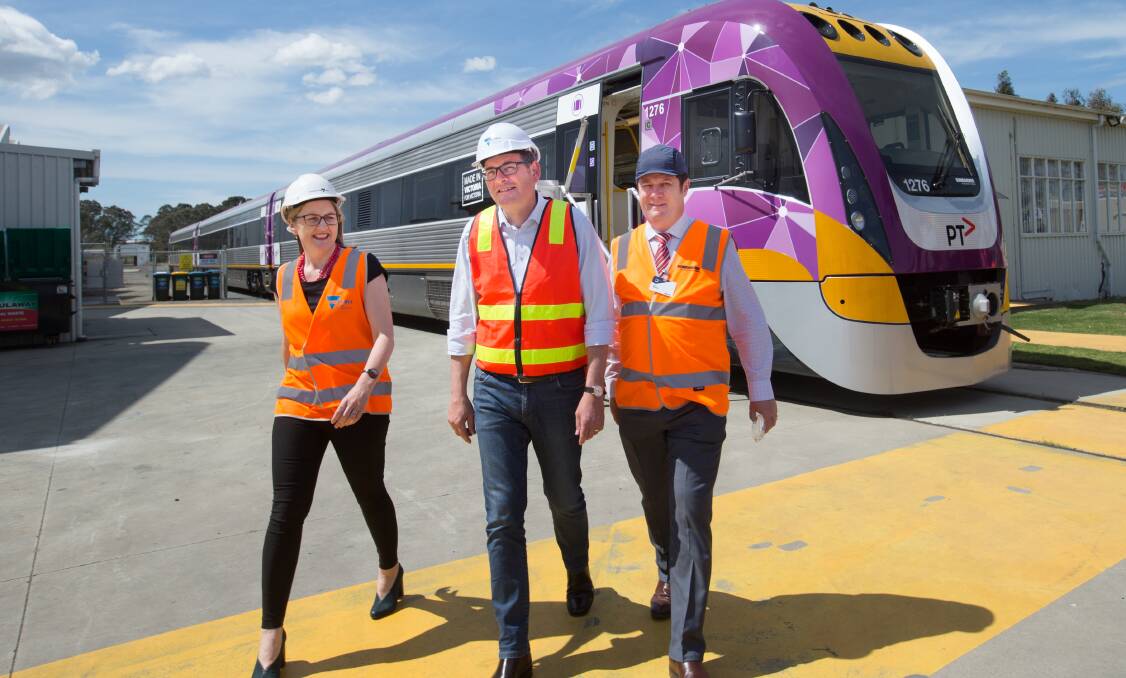 Transport Minister Jacinta Allan ,Victorian Premier Daniel Andrews and train manufacturer, Bombardier CEO Paul Brown with the new train. Photo: Simon Schluter. 