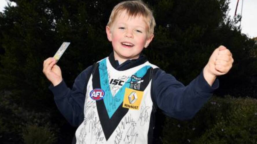 EXCITED: Caius Bull celebrated his sixth birthday waving to his Port Adelaide heroes when they arrived in Ballarat by bus on Friday afternoon. Picture: Kate Healy
