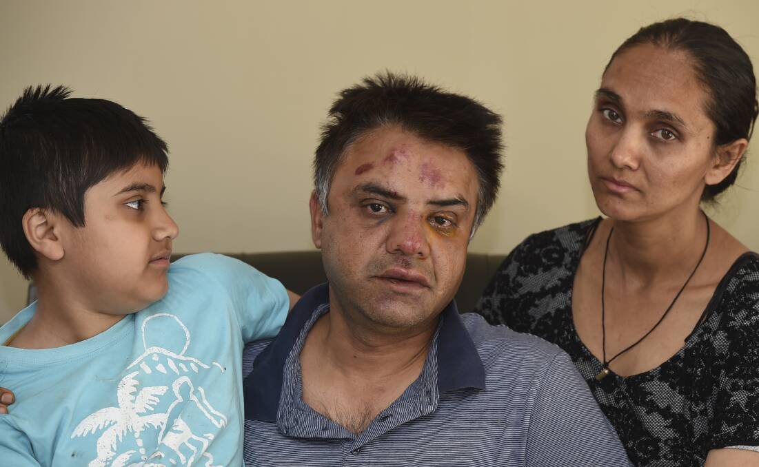 FRIGHTENED: Sumeet Anand with his 10-year-old son Yash Anand (left) and wife Mandeep Kaur Swaich (right) in their home. Picture: Lachlan Bence.