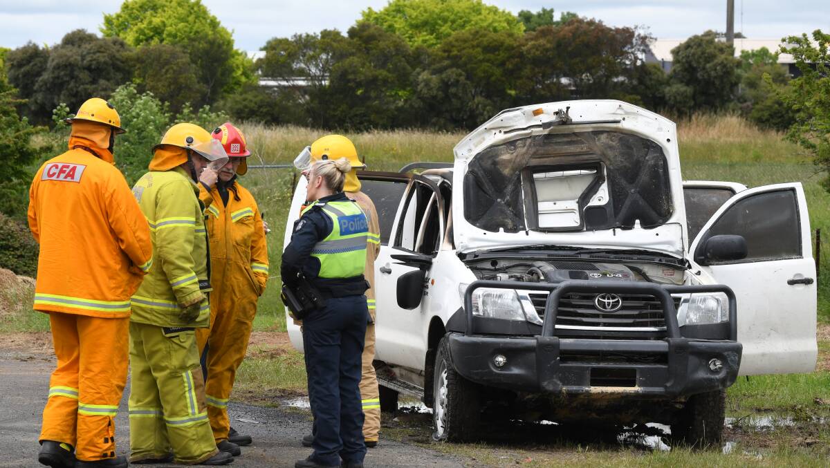 Police and firefighters investigated the car fire in Mount Rowan. Photo: Lachlan Bence.