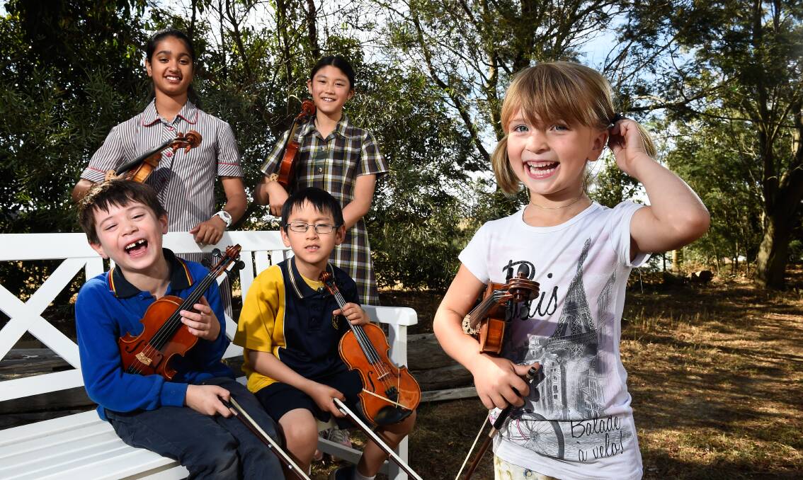 READY TO ROLL: These five music students are fine tuning ahead of the Concert in a Day at Buninyong Town Hall. Back: Shriya Patel (13), Biju Shimokawa (10). Front: William Ward (8), Tiger Zhuang (7) and Anna Macak (4).