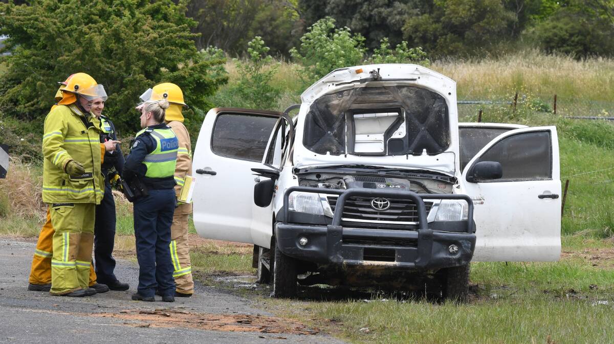 Police and firefighters investigated the car fire in Mount Rowan. Photo: Lachlan Bence.