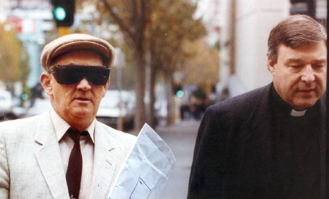 The infamous photo of Pell supporting Ridsdale on the way to court in 1993.