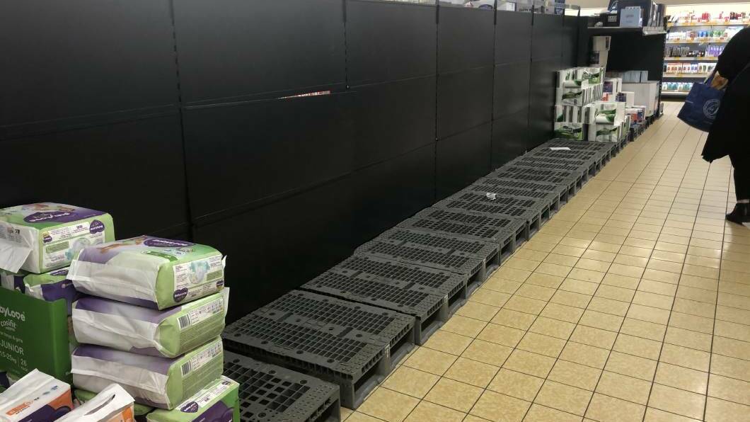 Empty pallets in Aldi during the week.