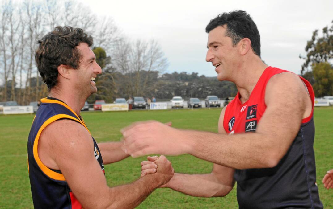 Former Collingwood teammates Shane O'Bree and Simon Prestigiacomo playing for opposite CHFL sides in 2011.