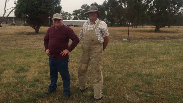LOCALS: Pastor Jim McMillan and grazier Tom Davies watch the fire from a distance.