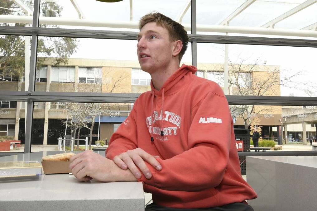 SQUEEZED: Jayden Toole takes a break from his first year psychology studies at Federation University for a quick lunch in the uni cafe. Picture: Lachlan Bence.