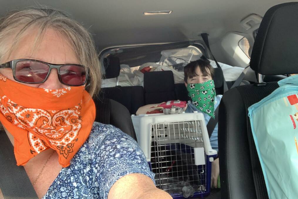 Andrea and James using bandanas to cover their faces while fleeing the fires on Tuesday.