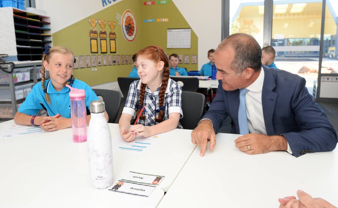 Education Minister James Merlino with pupils Izabella and Nyah at Lucas Primary School's opening day earlier this year.