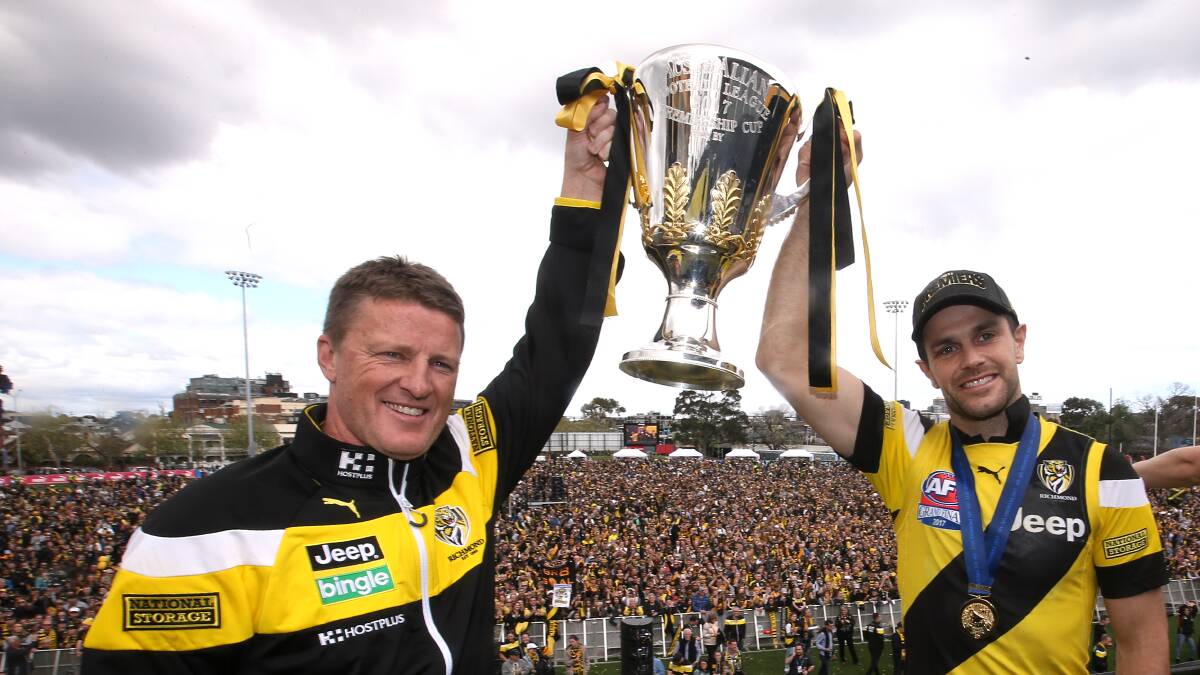 Coach Damien Hardwick and captain Trent Cotchin parade the cup at Punt Road on the Sunday following the grand final.