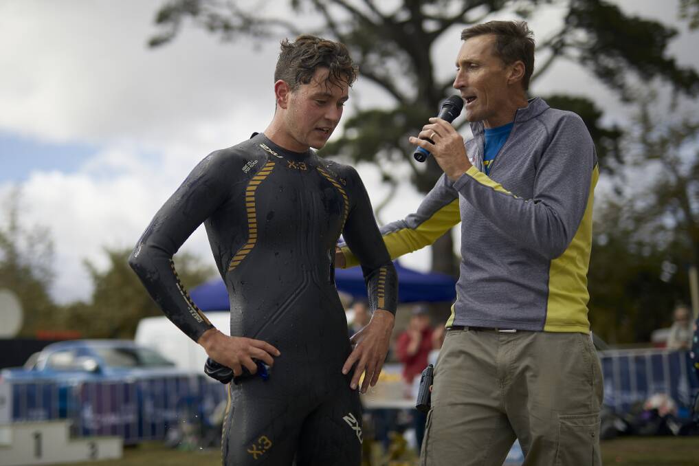 INAUGURAL WINNER: Swim to the Rings winner Tom Halliday chats to organiser and Ballarat Triathlon Club president Dale Coutts after winning the event on Sunday. Picture: Luka Kauzlaric