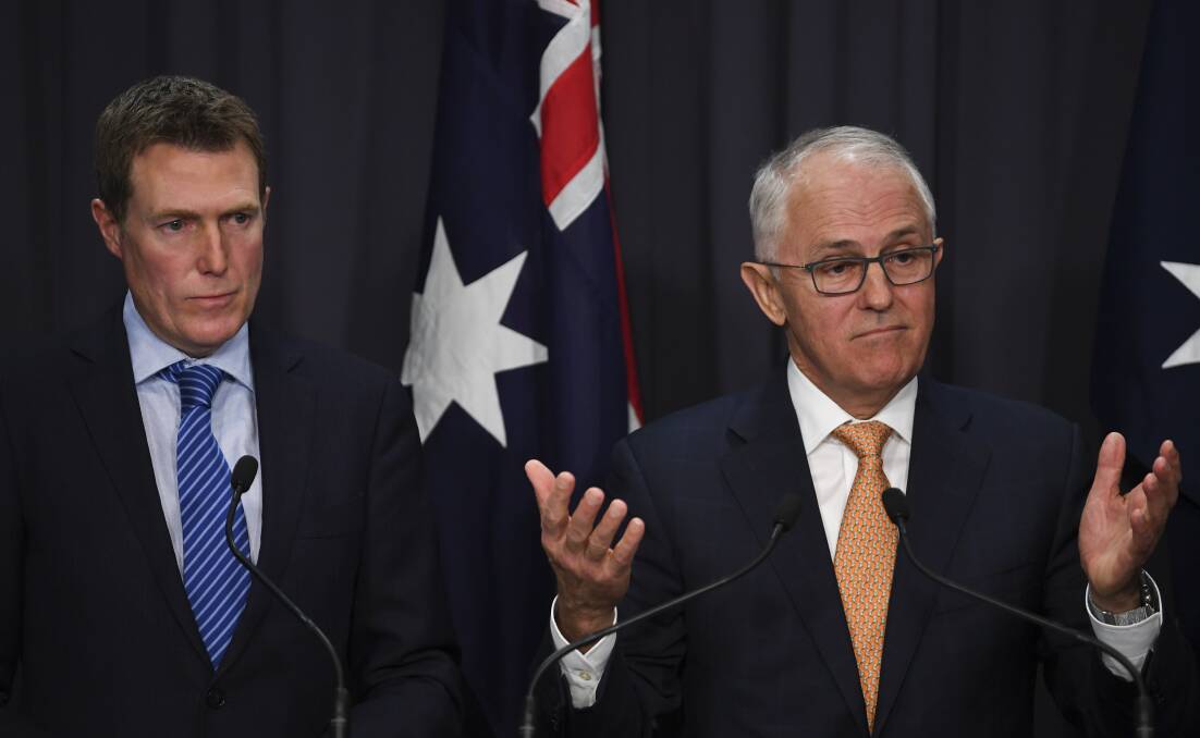 Australian Prime Minister Malcolm Turnbull speaks (right) as Australian Attorney-General Christian Porter looks on during a press conference at Parliament House in Canberra.