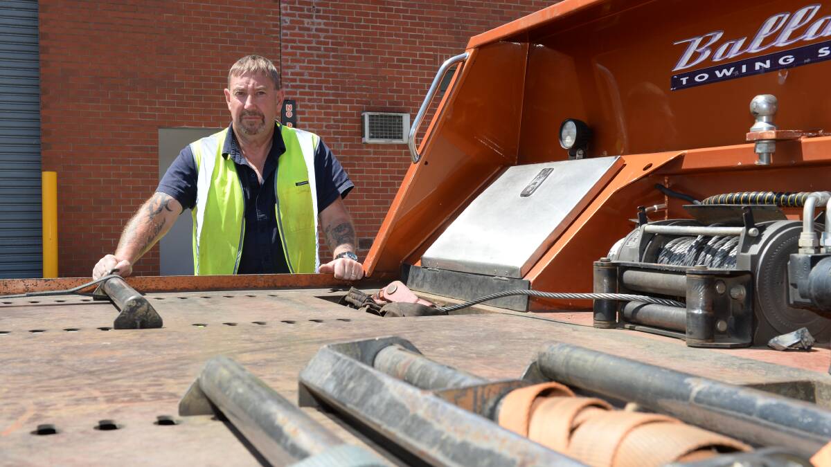 Mick Shillington with the Ballarat Towing Service truck which was robbed of a wheel tie. Picture: Kate Healy.