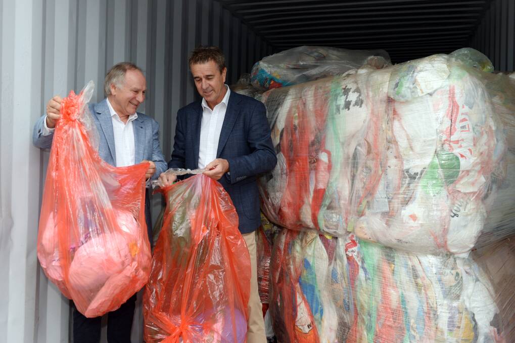 RECYCLING: Replas Directors Mark Jacobsen and Russell Muller inspect some incoming plastic. Pictures: Kate Healy.