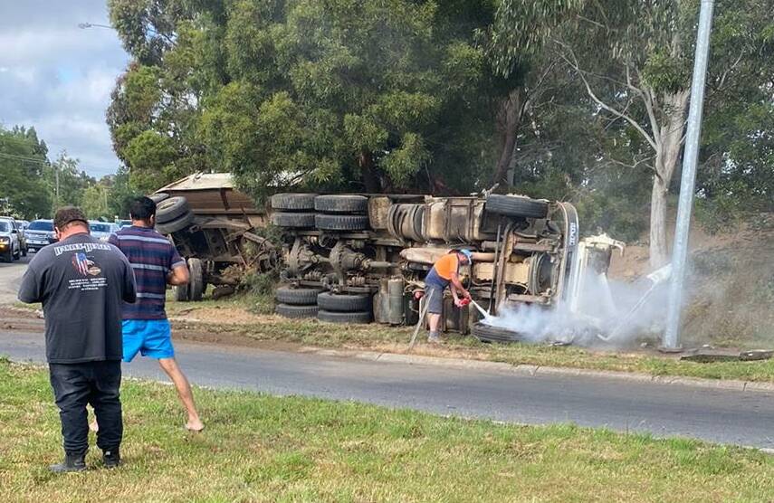 Lucky escape for two men after truck spears across road and rolls