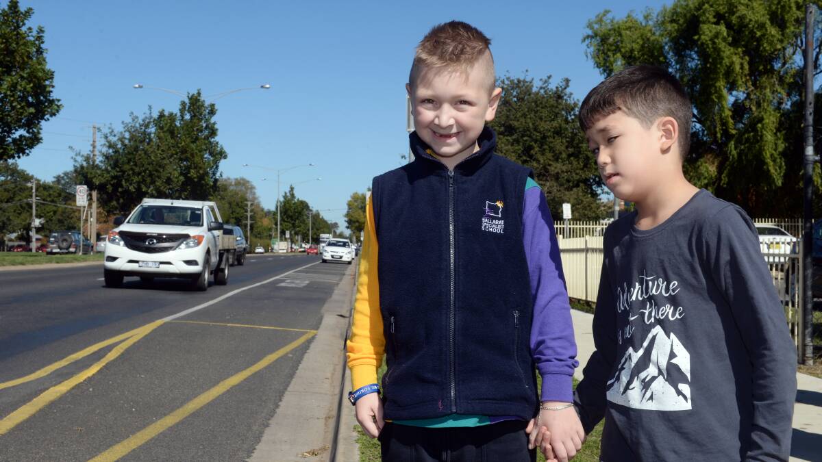 CROSSING WITH EASE: Kayleb, 7, and Issy, 7, from Ballarat Specialist School will be able to cross the road safely. Picture: Kate Healy 