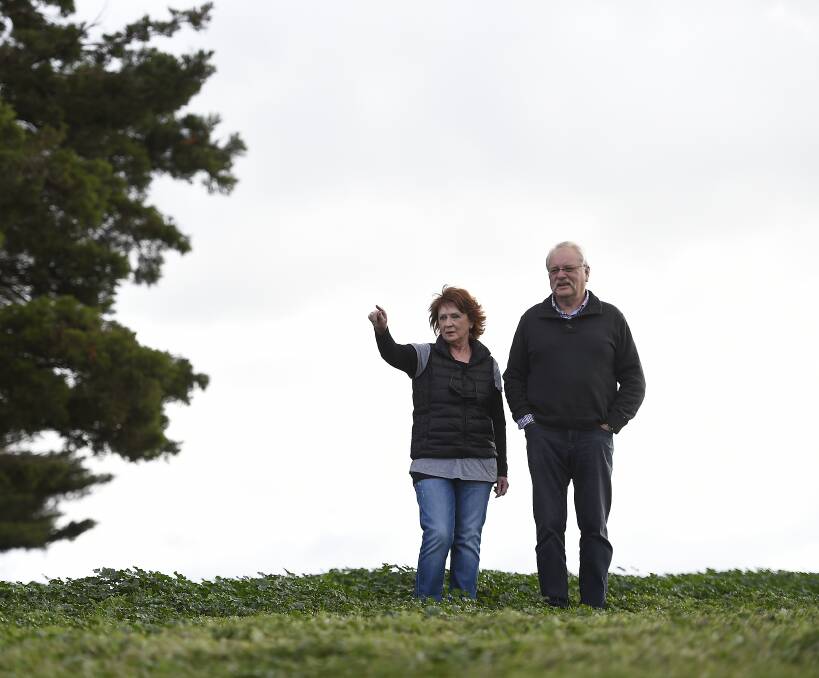FEARFUL: Miners Rest residents Eileen McGhee and Werner Oellering remain concerned about flooding, health risks and increased traffic congestion as a result of the saleyards relocation. 