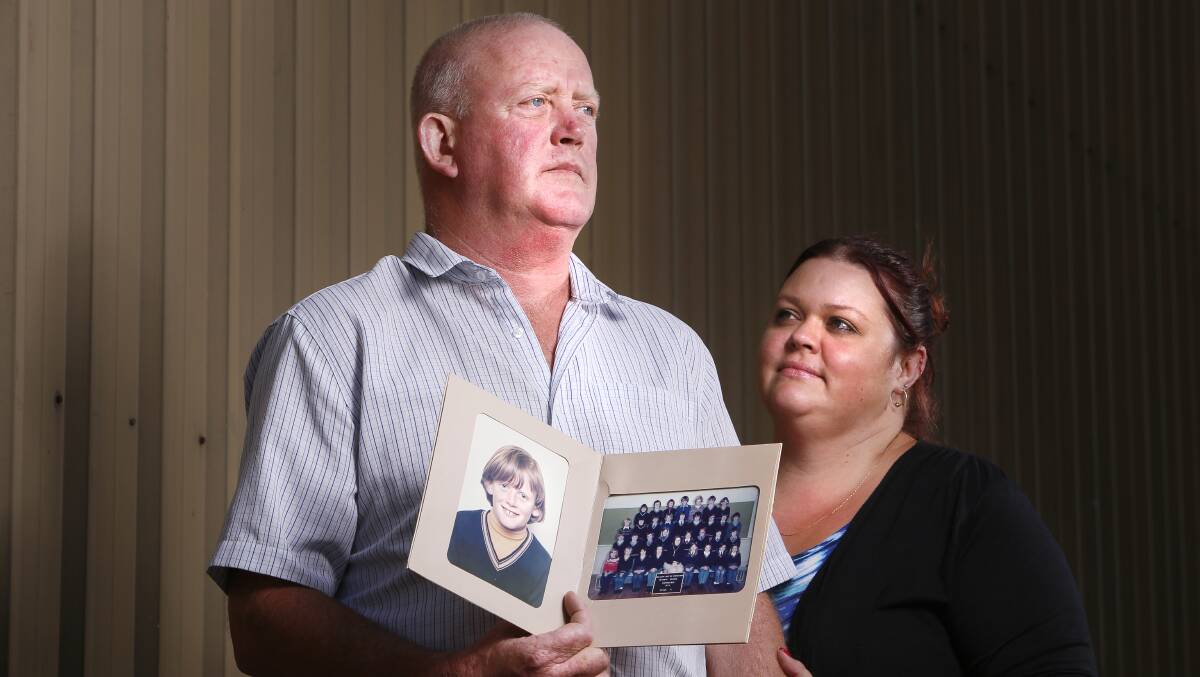 LIFETIME OF PAIN: Dominic Ridsdale who was sexually abused by his uncle disgraced priest Gerald Ridsdale holds childhood photos of himself with his fiancée Lana Johnston. Picture: Luka Kauzlaric 