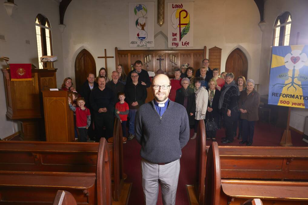 GATHERED: St John's Lutheran Church, Rev Adrian Kramer with his Ballarat congregation on Sunday. Picture: Luka Kauzlaric