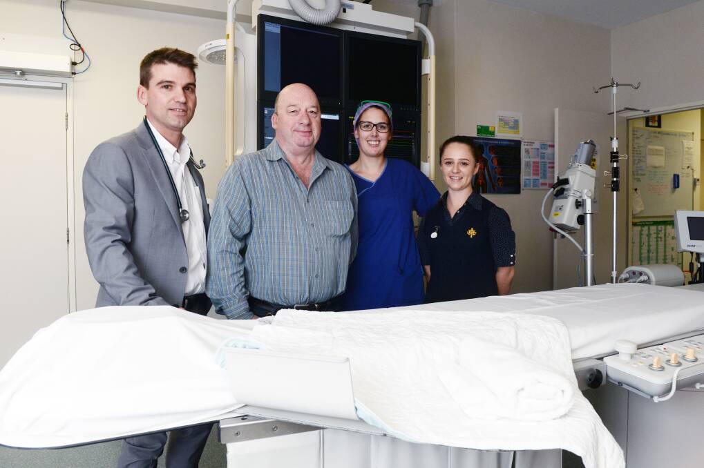 HEALTHY: St John of God Hospital cardiac catheter laboratory director Dr Chris Hengel, patient Colin Jones and nurses Janna Mayall and April Scanlon. The staff helped Mr Jones during a heart attack. Picture: Kate Healy