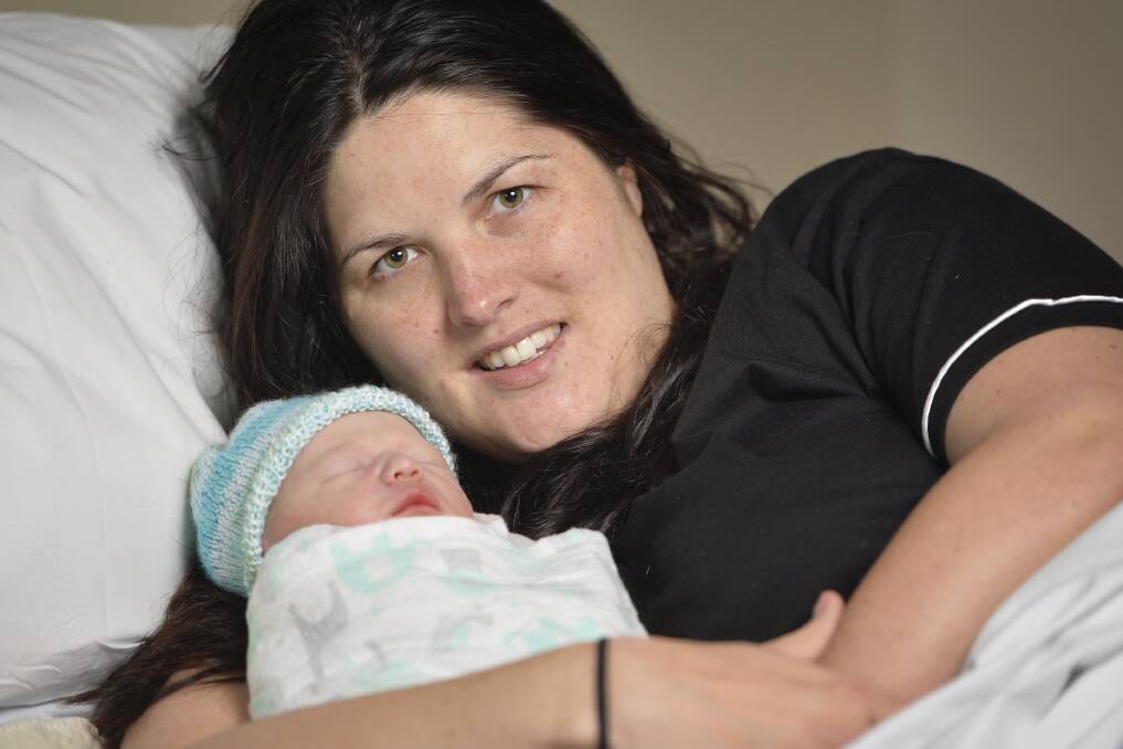 NEW MOTHER: Jess Shaw cuddles her new baby boy, Archie, who was born on Mother's Day, at Ballarat Base Hospital. Picture: Dylan Burns