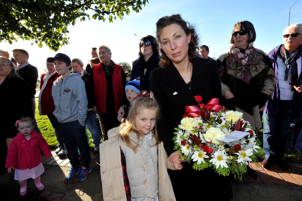 Sarah De Santis with her daughter Ruby, at 2015 Anzac Day ceremony. Picture: Jeremy Bannister