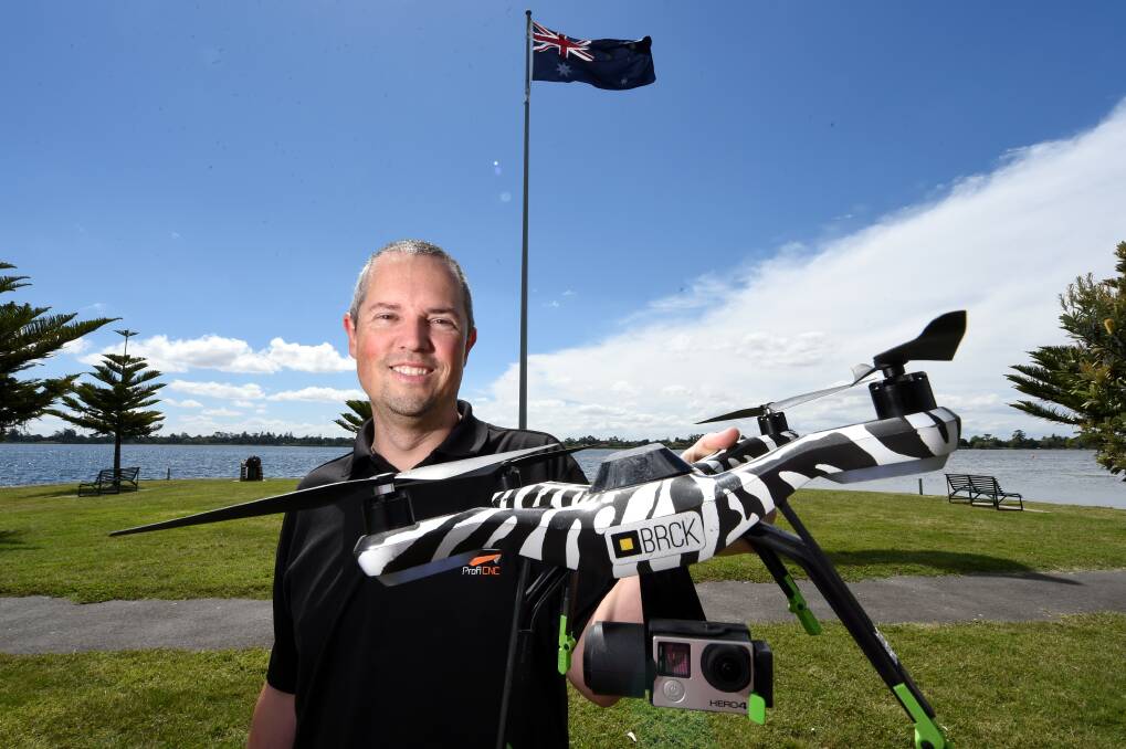 Philip Rowse with his drone. Mr Rowse sells auto-pilot systems in Australia and overseas.