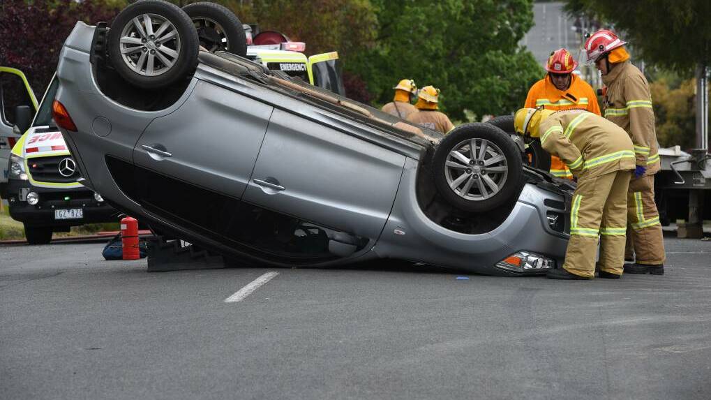 A car rolled during a multi-car collision. Picture: Lachlan Bence