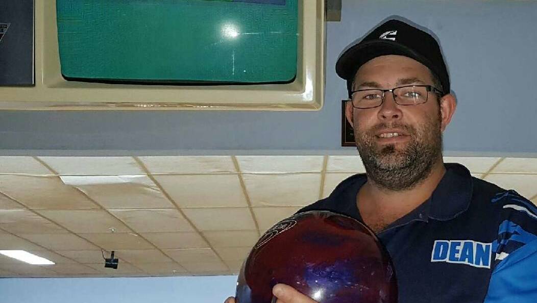 PERFECT GAME: Dean Mattei proudly shows off his perfect score of 300. Jason Allen also bowled a perfect game, but was unavailable for a photo.