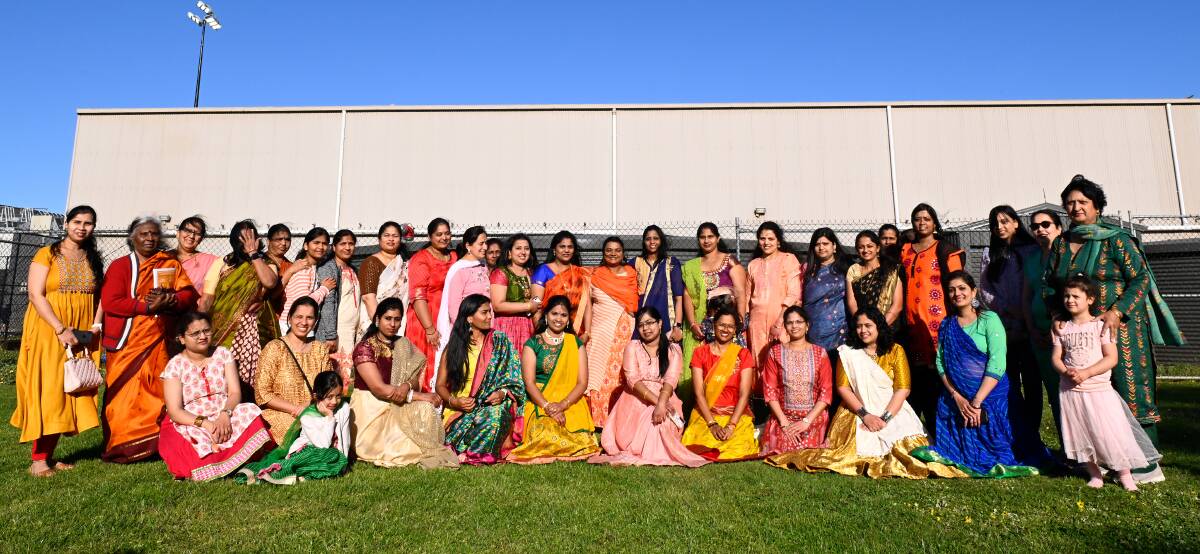 Hindu women wearing their traditional saris, as part of the festival program. Picture by Adam Trafford. 