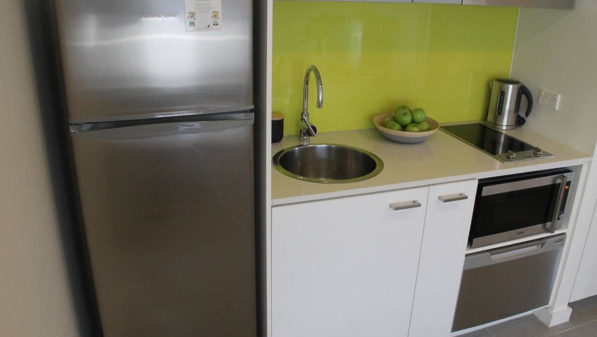 Typifying the new-look apartment-hotel … the functional kitchenette.