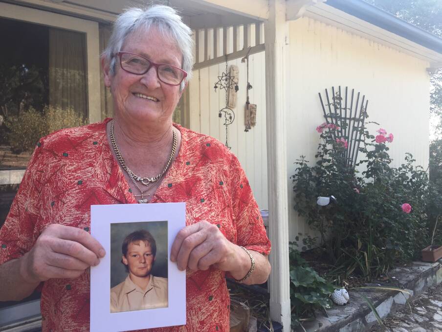 Gone: Helen Watson with one of her favourite pictures of her son Peter. He was abused by former priest Paul David Ryan and took his own life. Helen is now calling for victims to seek help. Picture: Jolyon Attwooll
