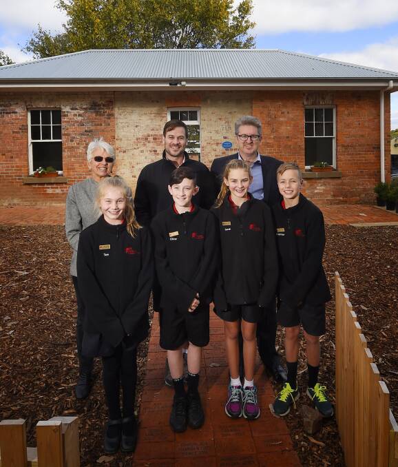 Proud: Back row: Anne King, Josh Ebbels, Peter Mees. Front row: School captains Tam Petrov, Oliver Marshall, Sarah Elsey and Connor Brisbane at the former police station at Buninyong Primary School. PICTURE: Luka Kauzlaric