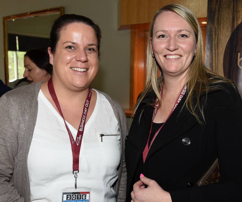 Keen learners: Bronywn Britton and Megan McPherson at Commerce Ballarat's Business Day Out, where Jeff Kennett was the star speaker. PICTURE: Lachlan Bence
