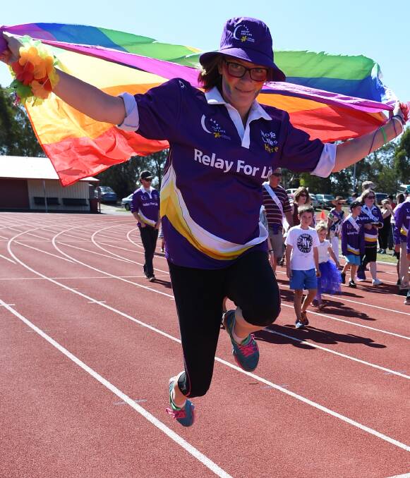 Jumping for life: Chloe Mason on a lap of the Relay for Life track on Saturday. PICTURE: Lachlan Bence