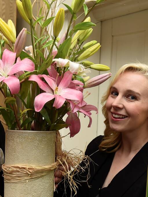 Flower power: Power FM presenter Jules Zass is a SpringFest ambassador with Bruce Roberts. PICTURE: Lachlan Bence