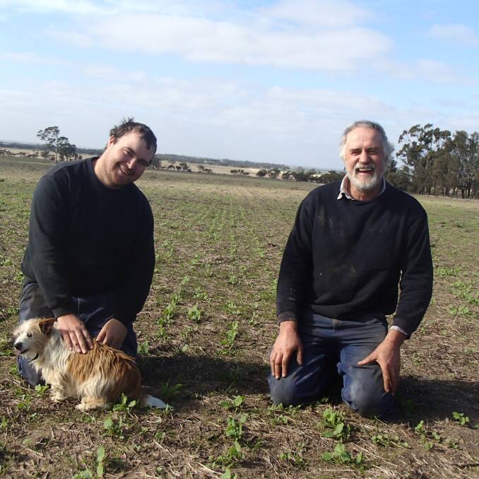 TOUGH: Glenlee farmers Adam and Greg Schwedes in a paddock of newly emerged Bonito canola, sown mid-May. Picture: GREGOR HEARD