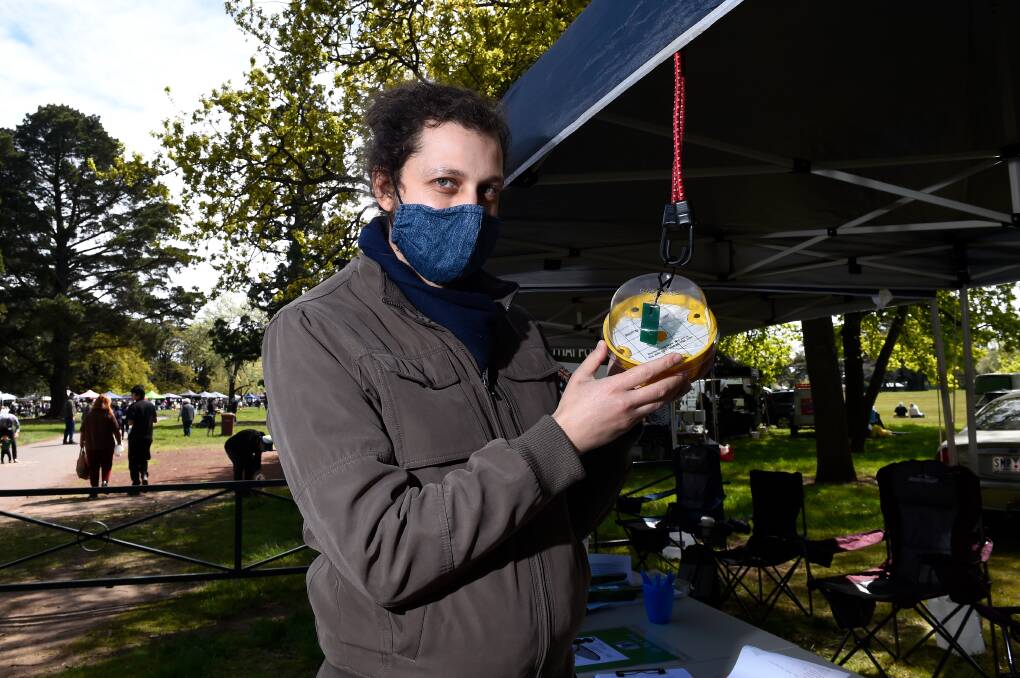 Ben Nunquam of the Ballarat Permaculture Guild holding a fly trap at the Ballarat Farmers Market. The pest has been allegedly sighted in Ballarat and Clunes in recent times. Picture: Noni Hyett.
