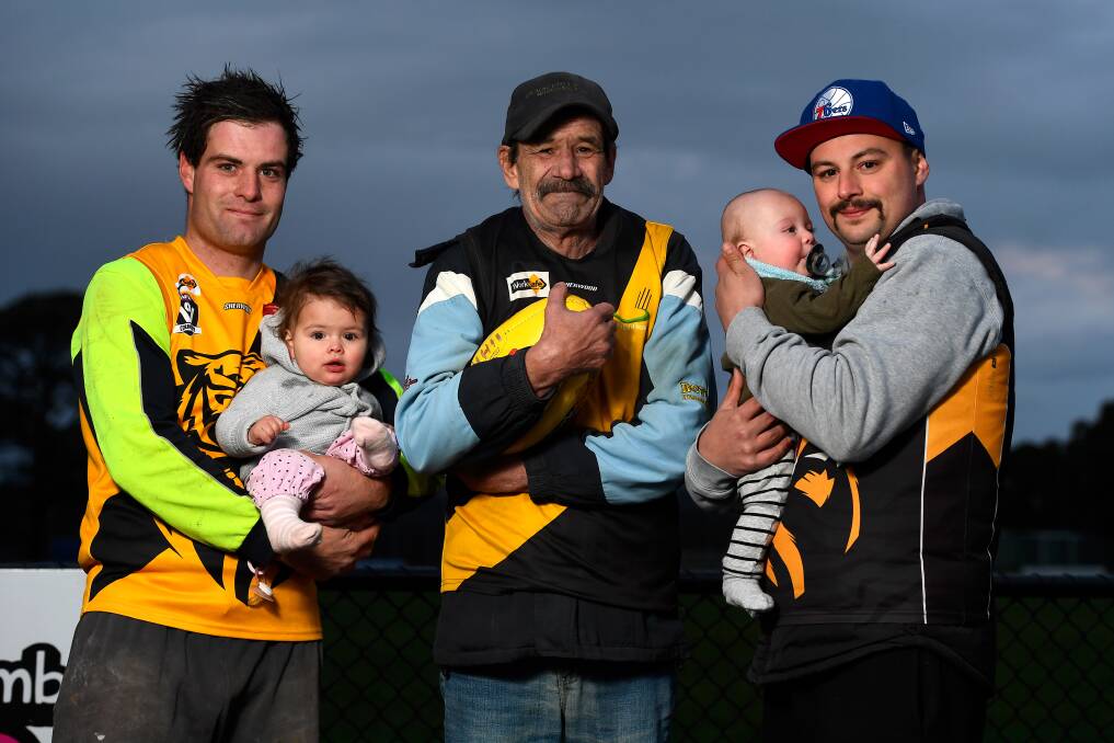 John is pictured with his sons Brett (left) - holding baby Indiana, and Darren - holding baby Oliver. Picture: Adam Trafford