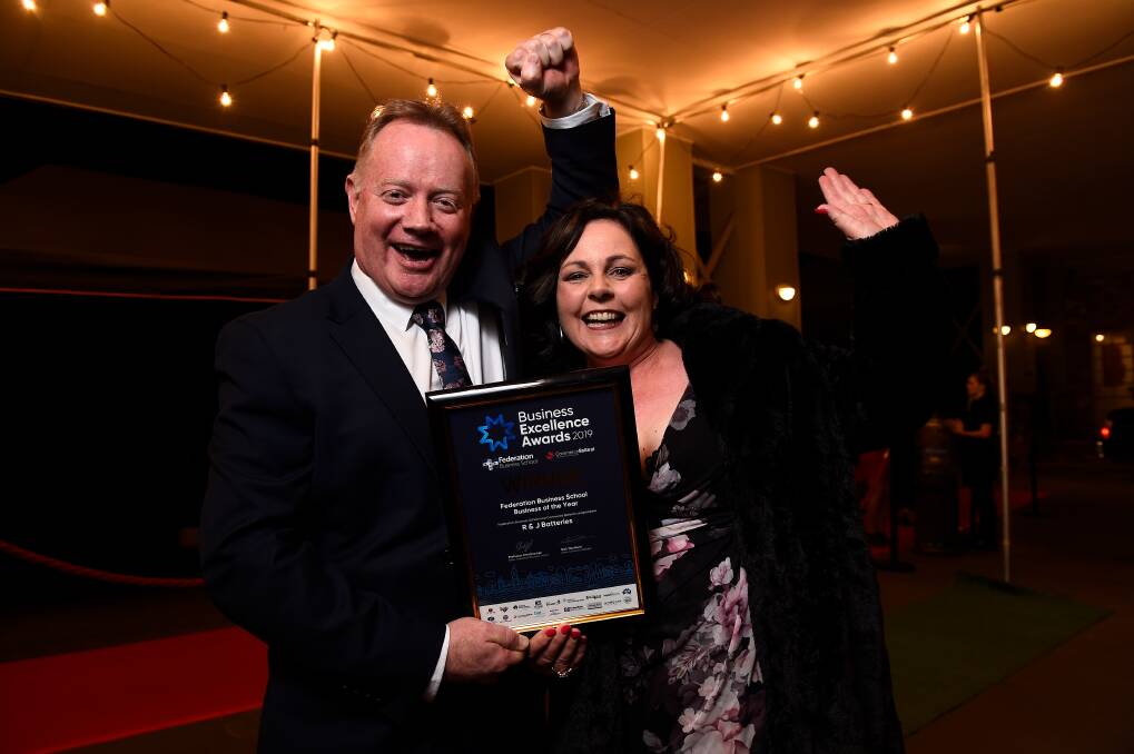 POWER TO THE PEOPLE: R & J Batteries General Manager Stuart Hamilton celebrates with wife Wendy Hamilton after taking out the Federation Business School Business of the Year. Picture: Adam Trafford