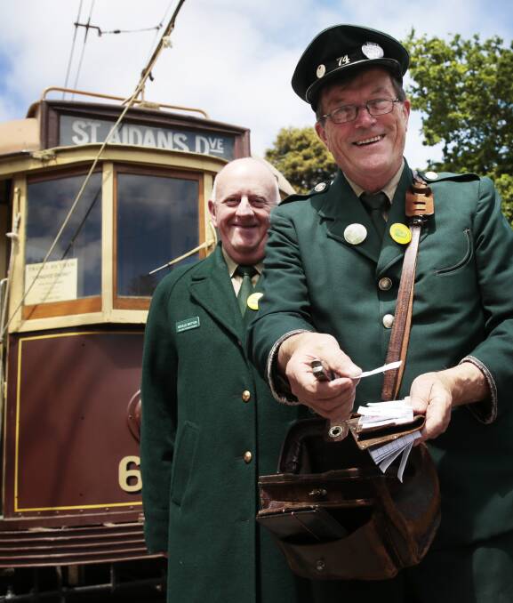 Ticket to yesteryear: Neville Britton and Len Millar of the Ballarat Tramway Museum sell $2 vintage tram rides. Picture: Luka Kauzlaric