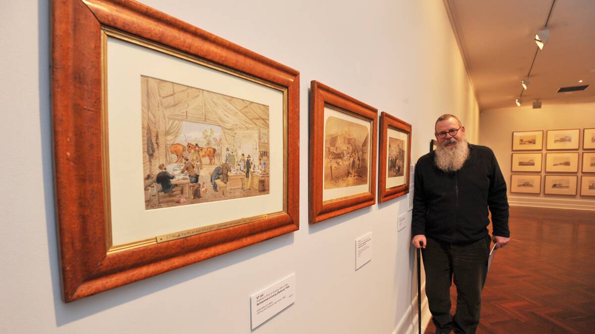 Art Gallery of Ballarat director Gordon Morrison with some of the gallery's S.T. Gill watercolours.