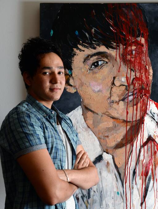 Electrifying: Alidad Afzali, 18, and his portrait of a friend who was killed by terrorists back home. The talented young artist's future in Australia is uncertain. Picture: Kate Healy