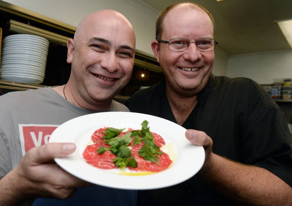 Plates to be proud of: The Plough's chef Mark Mills with Kuala Lumpar chef Jaffery Othman. The restaurant has venues in Trentham and Myrniong. Picture: Kate Healy