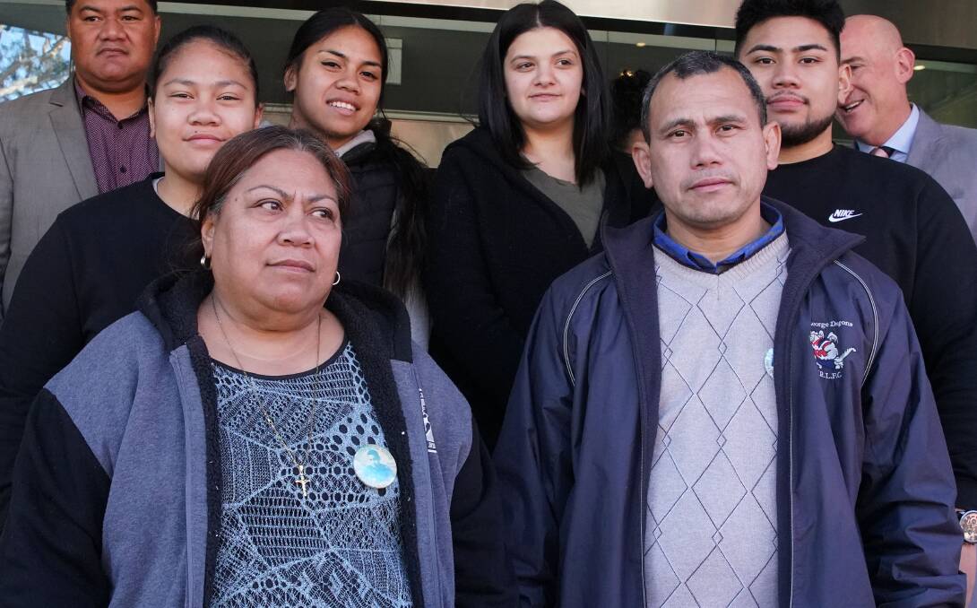 Parents of Junior Fenika, Atagai Togatuki (front left) and Vaea Togatuki (front right) with family and supporters at the inquest into Junior Fenika's death at Glebe Coroners Court in Sydney. Image: AAP /Ben Rushton.  