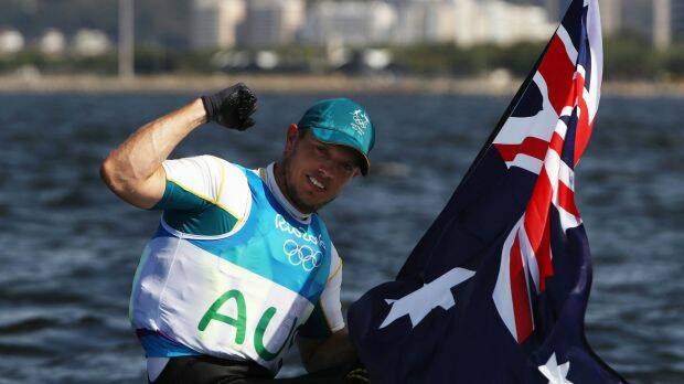 Tom Burton with an Australian flag after the win. Photo: Getty Images
