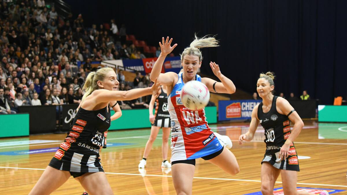 TOP-FLIGHT: Collingwood Magpies' April Brandley fights for possession with NSW Swifts' Natalie Haythornthwaite at the Silverdome. Picture: Paul Scambler